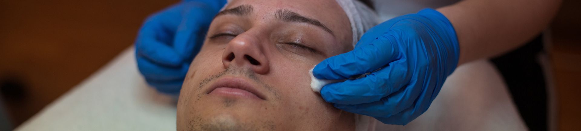 man receiving dermaplaning treatment